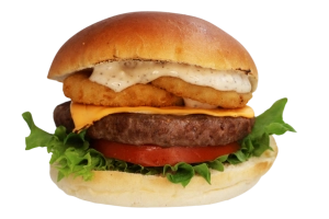 100% rundvlees burger (125 gr.) op een luxe broodje met cheddar, gebakken uienringen, sla, tomaat, augurk en truffel mayonaise.