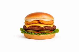 100% rundvlees burger (125 gr.) op een luxe broodje met cheddar, gebakken uienringen, sla, tomaat, augurk en truffel mayonaise.
